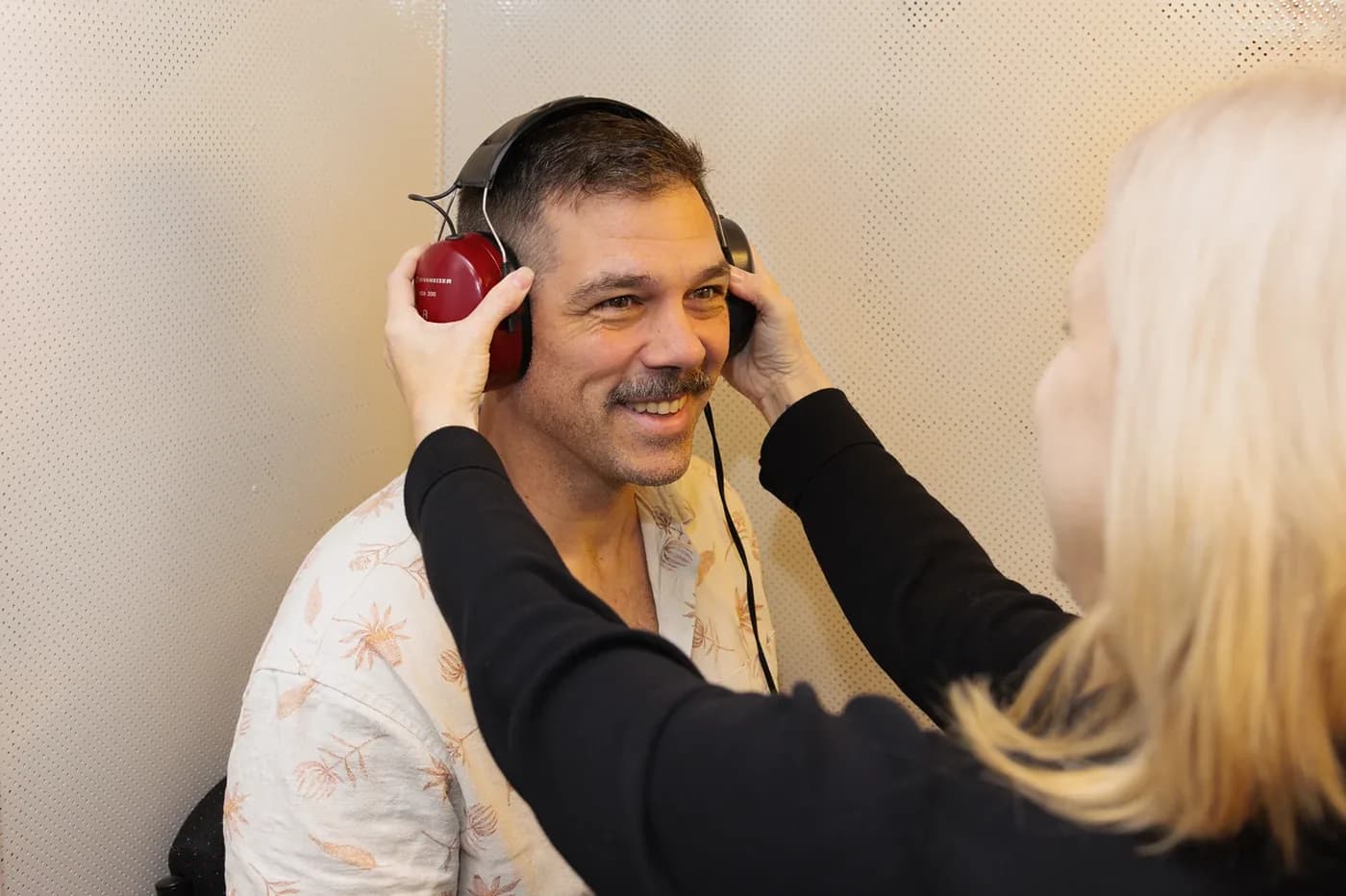A patient wearing headphones during a hearing test