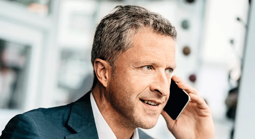 A man taking a phone call, from Phonak's Lyric campaign